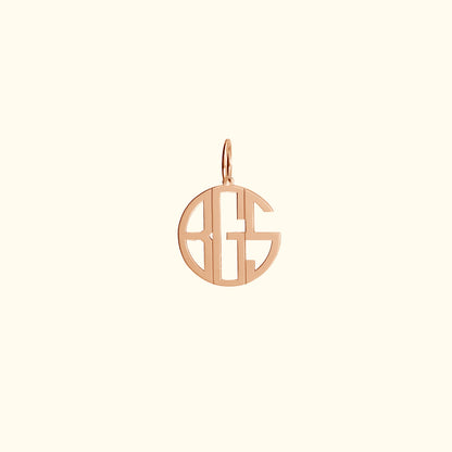 Rose gold monogram pendant in a circular design.