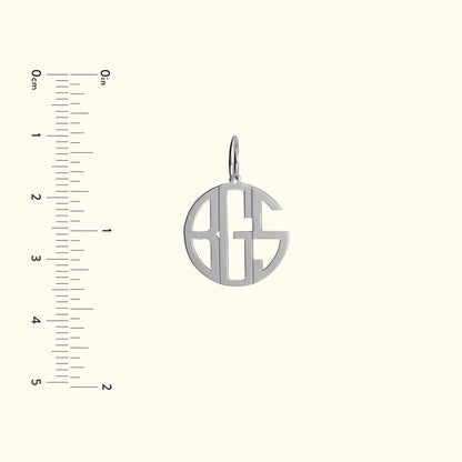 Silver monogram pendant featuring the letters A, G, and S, with a loop for attachment.