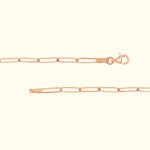 Delicate rose gold chain with a lobster clasp, showcasing elongated links.