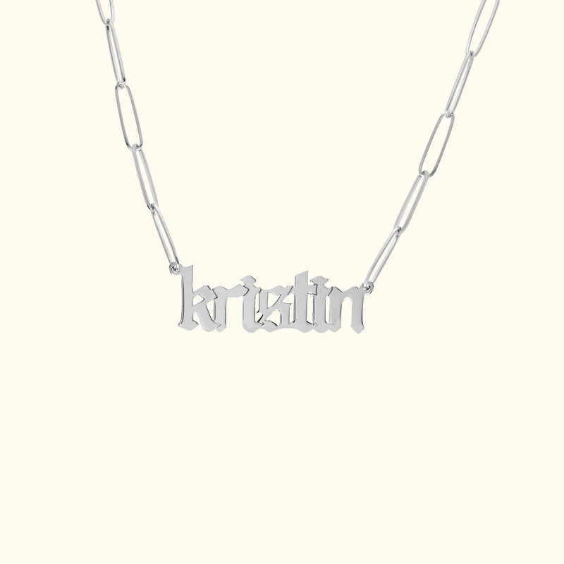 Silver name necklace with the word "kristin" in a stylish font.