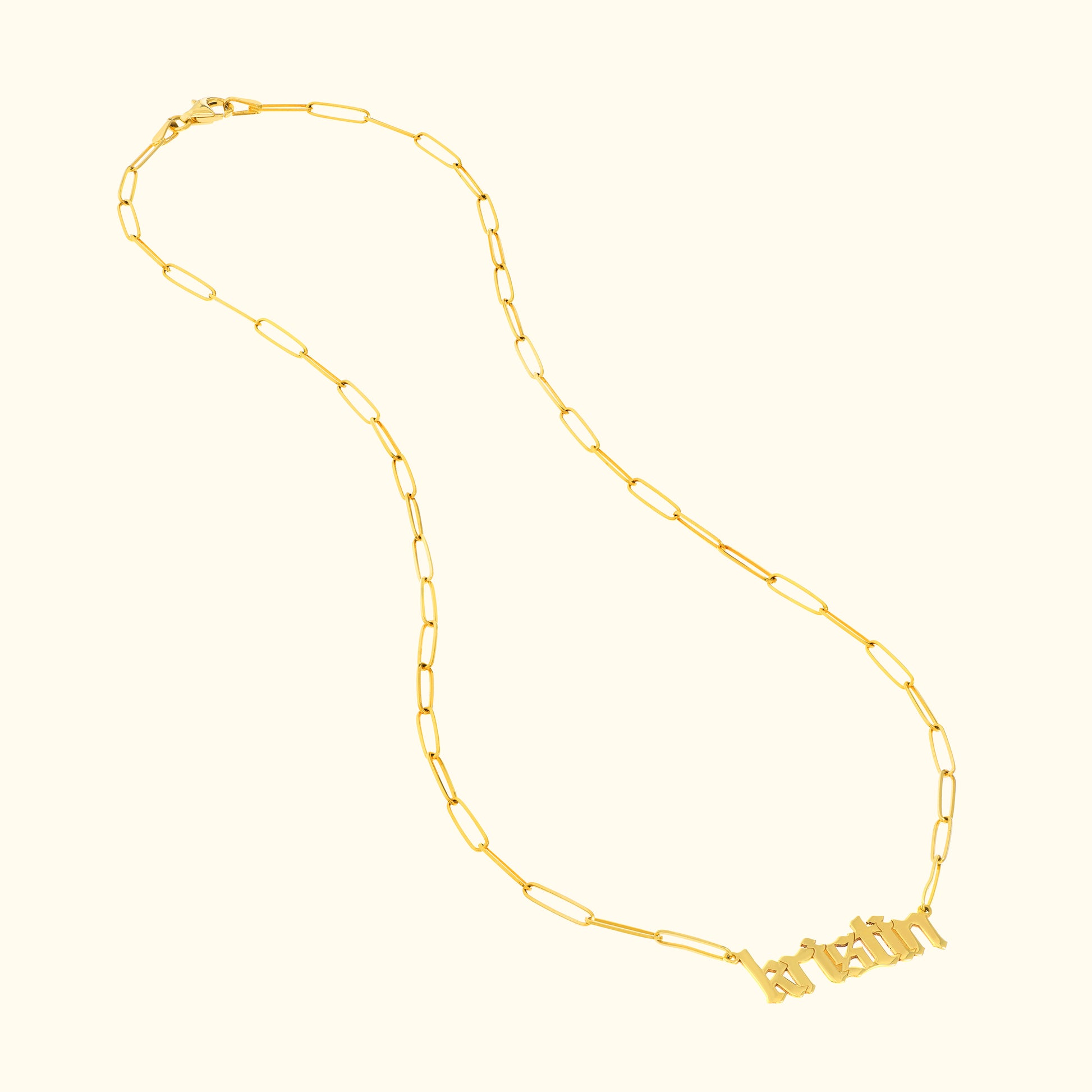 Gold chain necklace featuring a nameplate with the word "bratin."