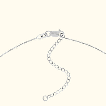 Silver necklace clasp with an adjustable chain extension.