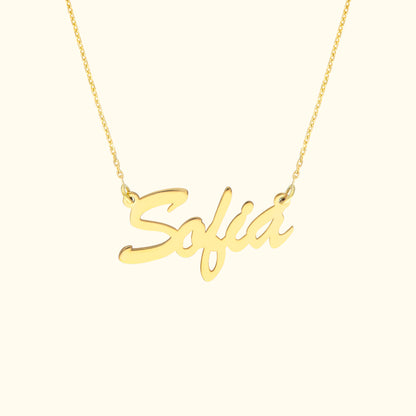 Gold necklace featuring a cursive nameplate reading "Sofia."