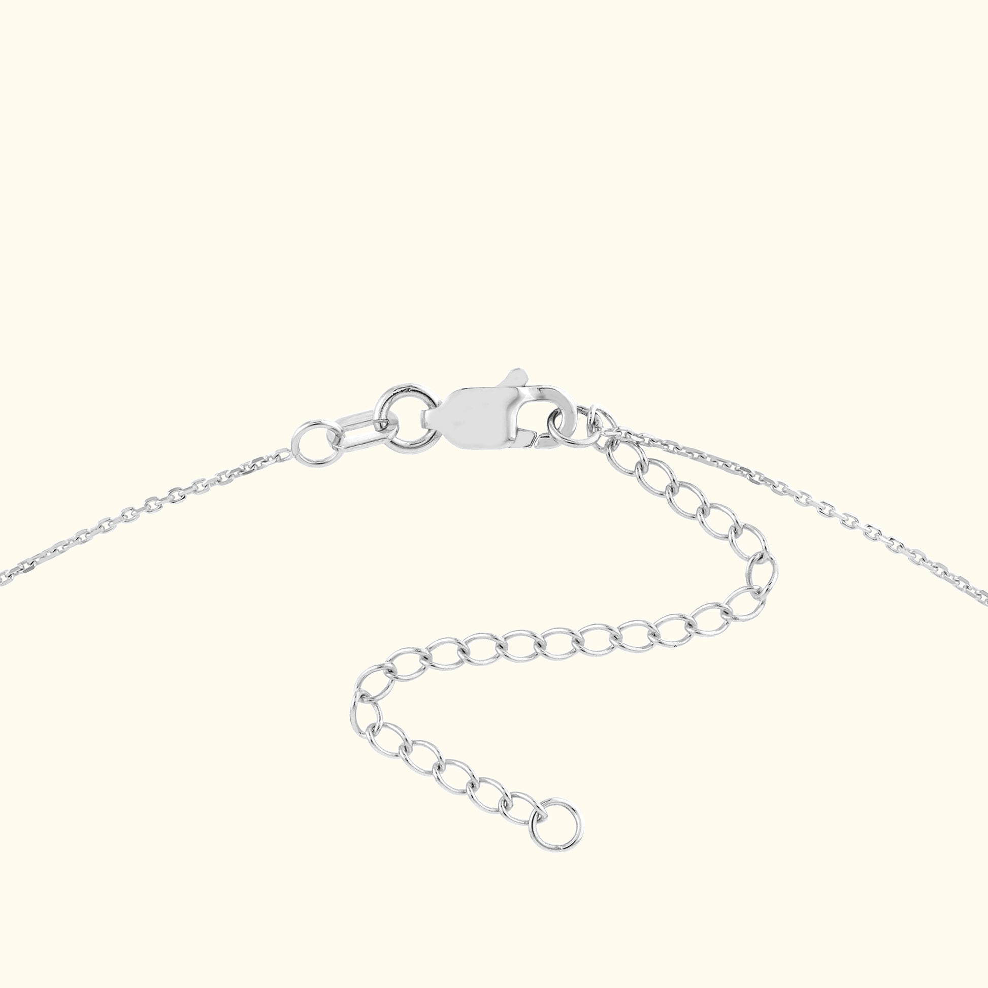 Delicate silver chain with a clasp and adjustable links.