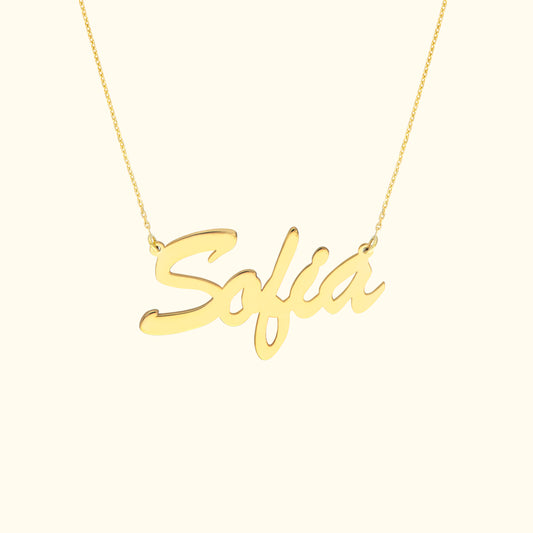 Gold necklace with the name "Sofia" in cursive lettering.