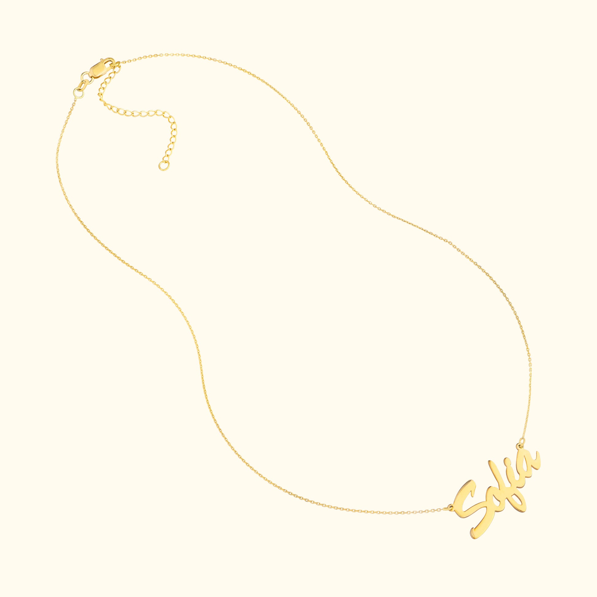 Gold necklace featuring a cursive name plate that reads "Sofía."