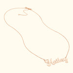 Rose gold necklace featuring the name "Hailey" in a cursive font.