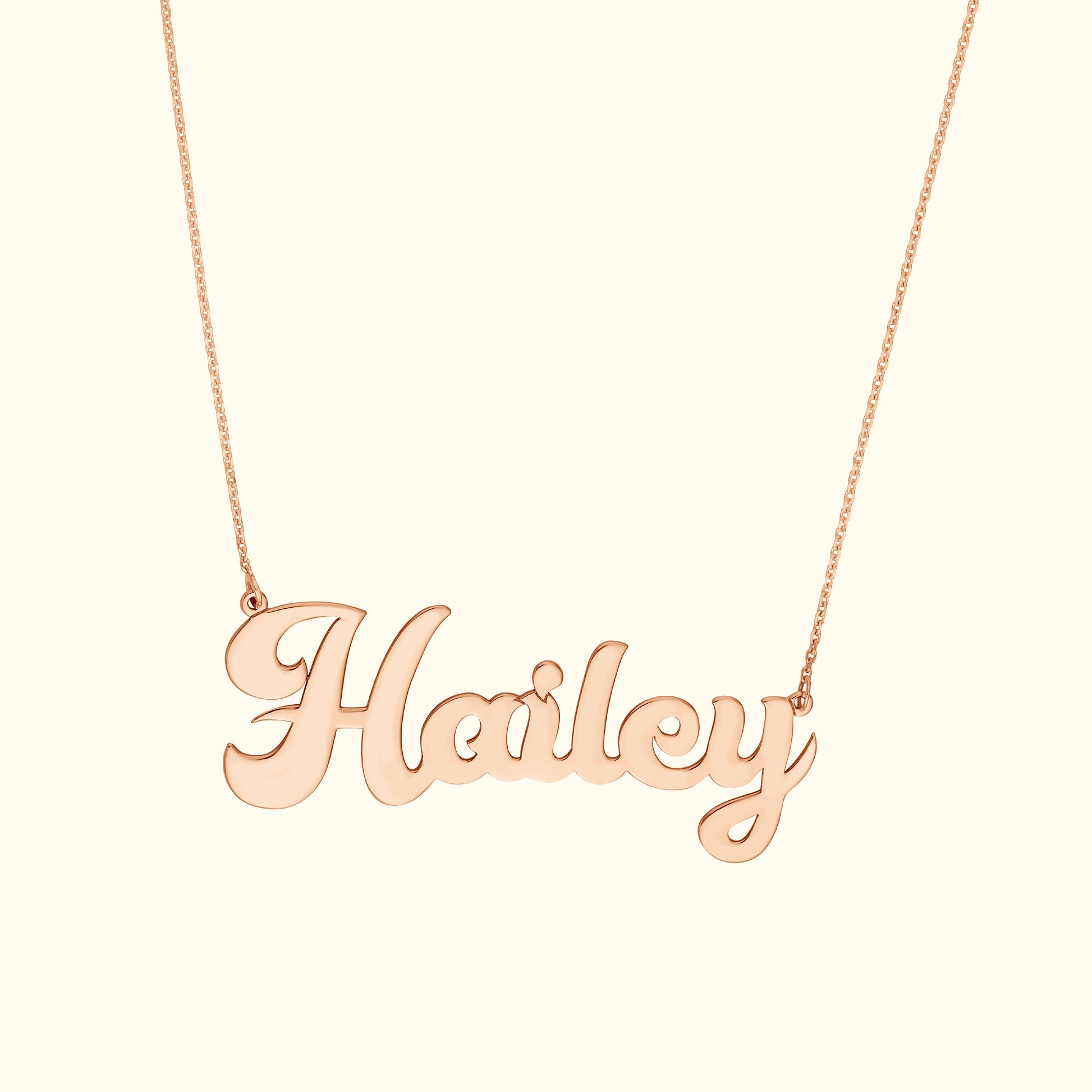 Rose gold necklace featuring the name "Hailey" in elegant cursive script.