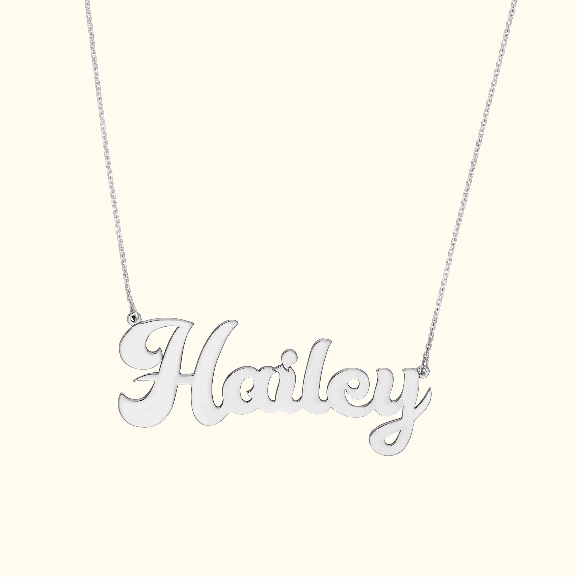 Silver necklace featuring the name "Hailey" in cursive lettering.