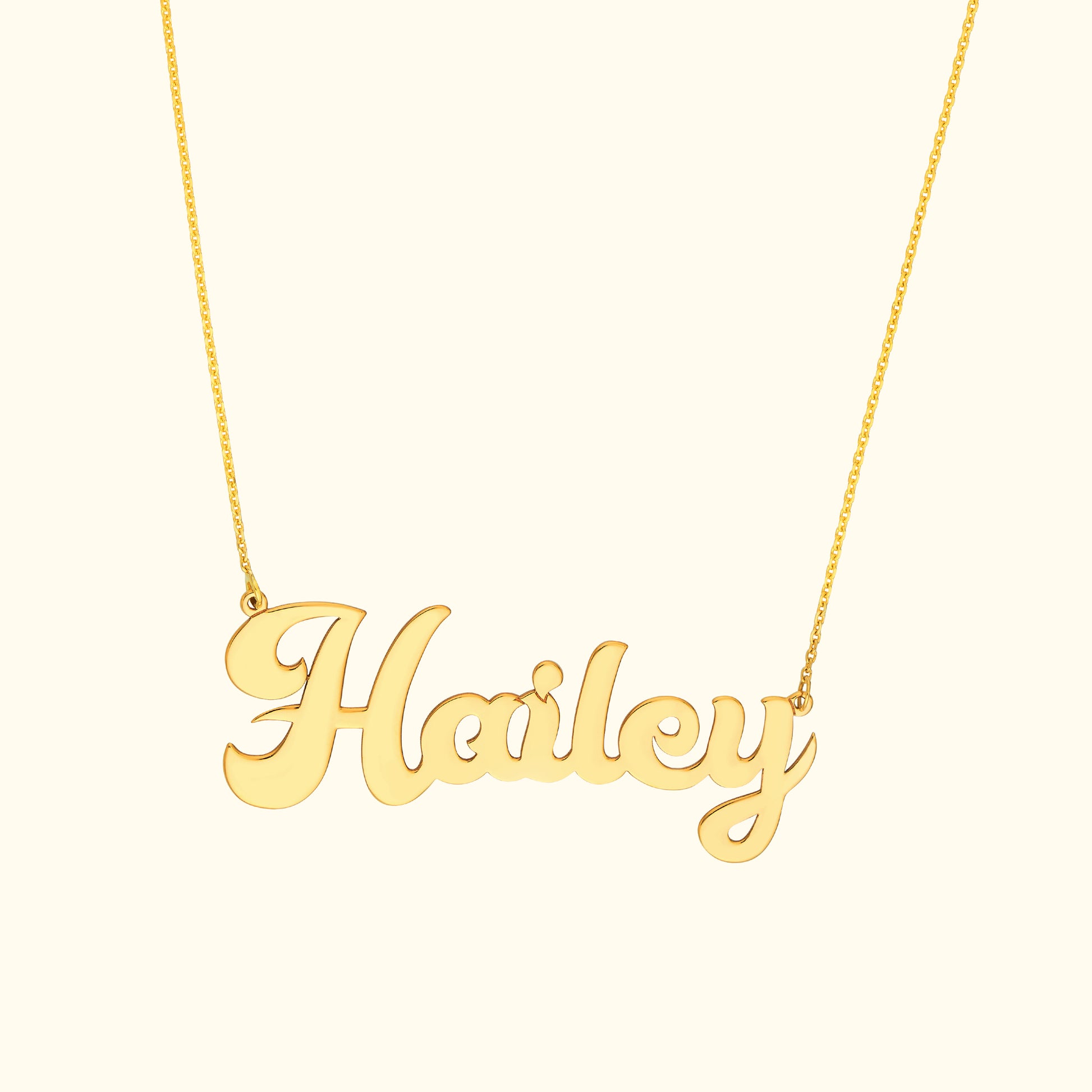 Gold necklace featuring the name "Hailey" in cursive script.