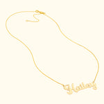 Gold necklace featuring a cursive name pendant reading "Hailey."