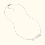 Silver nameplate necklace with the word "Charlotte" in stylized lettering.