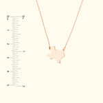 Rose gold necklace featuring a Texas state outline pendant.