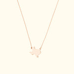 Gold pendant necklace featuring a Texas state silhouette on a delicate chain.