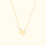 Gold necklace featuring a Texas state outline pendant on a delicate chain.