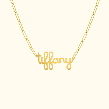 Gold necklace featuring the cursive name "tiffany" on a delicate chain.