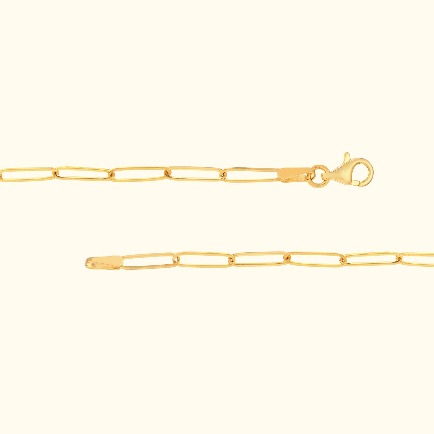 Thin gold chain bracelet with a lobster clasp and elongated links.