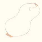 Rose gold necklace featuring a pendant with the year "2024".