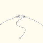 Silver chain bracelet with a clasp and an adjustable link.