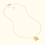 Gold necklace featuring a pendant with the number "12".