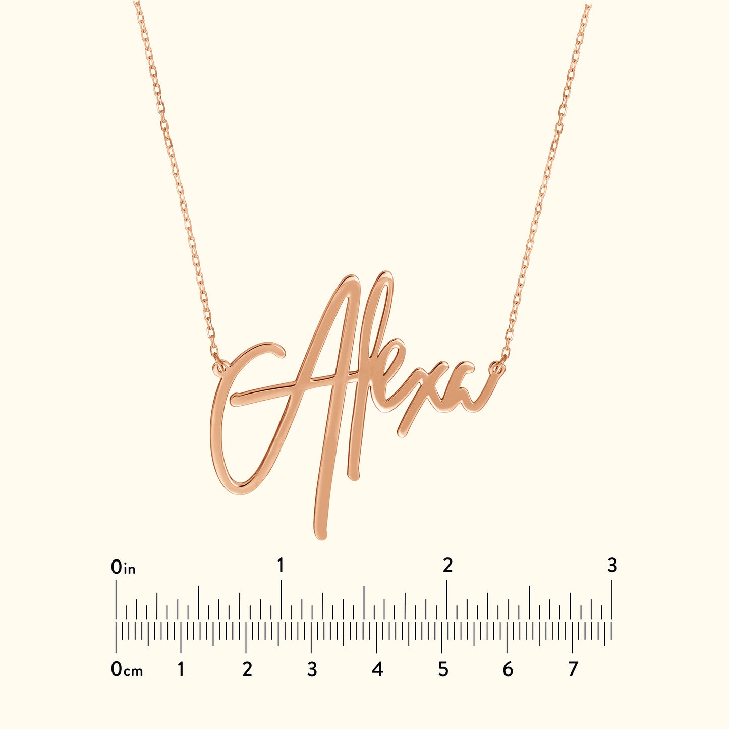 Rose gold necklace featuring a cursive name pendant "Alex."