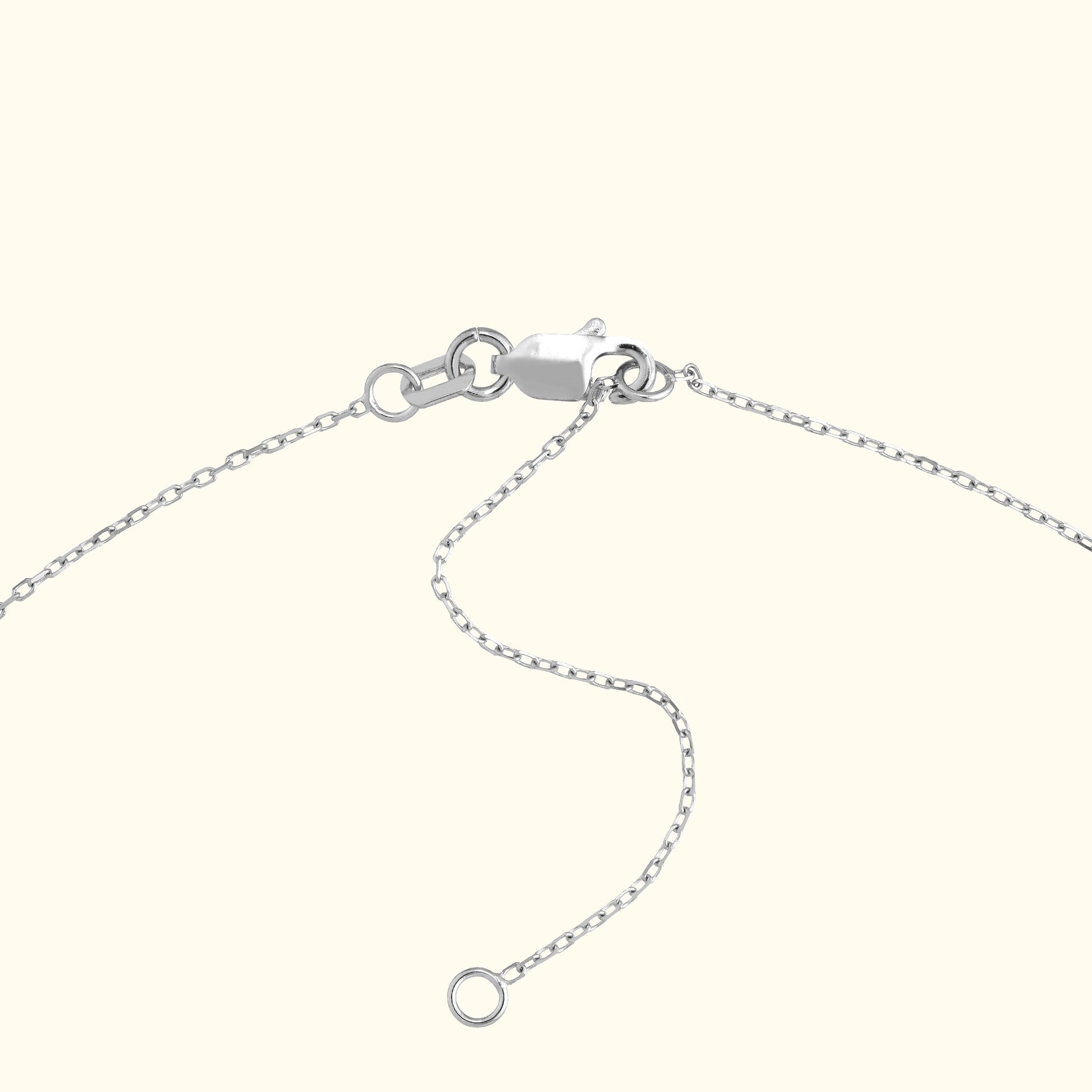 Silver chain bracelet with a lobster clasp and adjustable links.