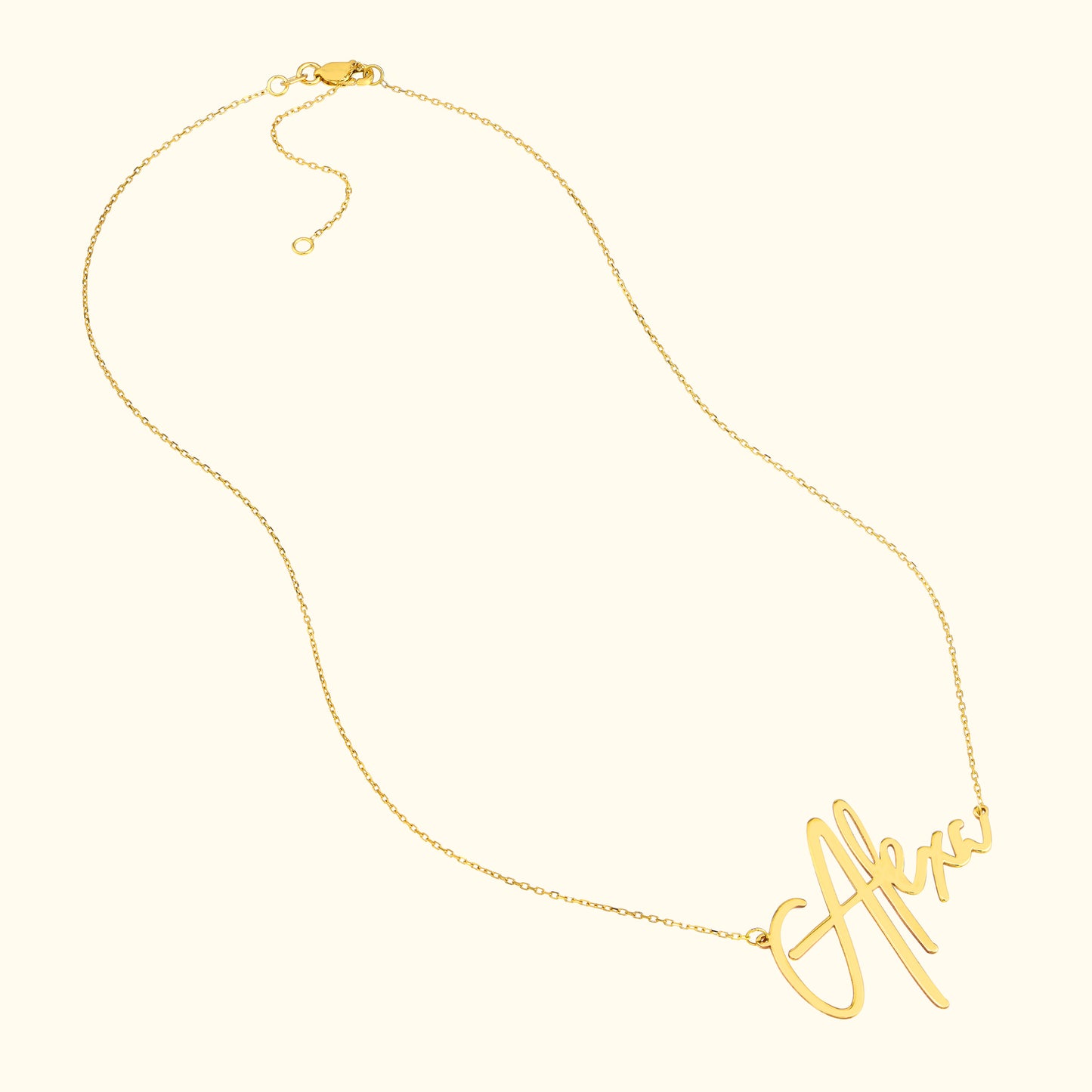 Gold necklace featuring a cursive name pendant, elegant and stylish design.