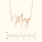 Rose gold name necklace reading "Mary" with a measuring scale below.