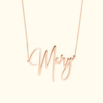Rose gold necklace featuring a cursive name pendant "Mary".