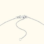 Silver chain necklace with a clasp and adjustable links.