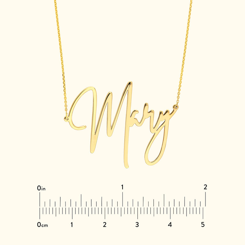 Gold necklace featuring a cursive nameplate that spells "Mary."