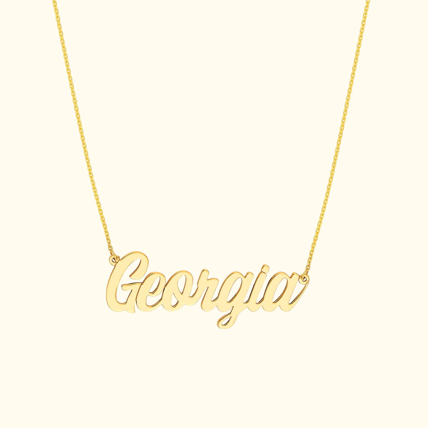 Gold necklace with the name "Georgia" in a cursive font.