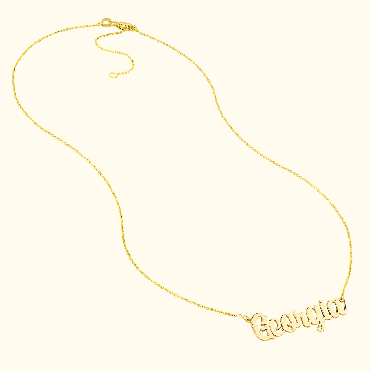 Gold necklace featuring the name "Georgia" in a cursive font.