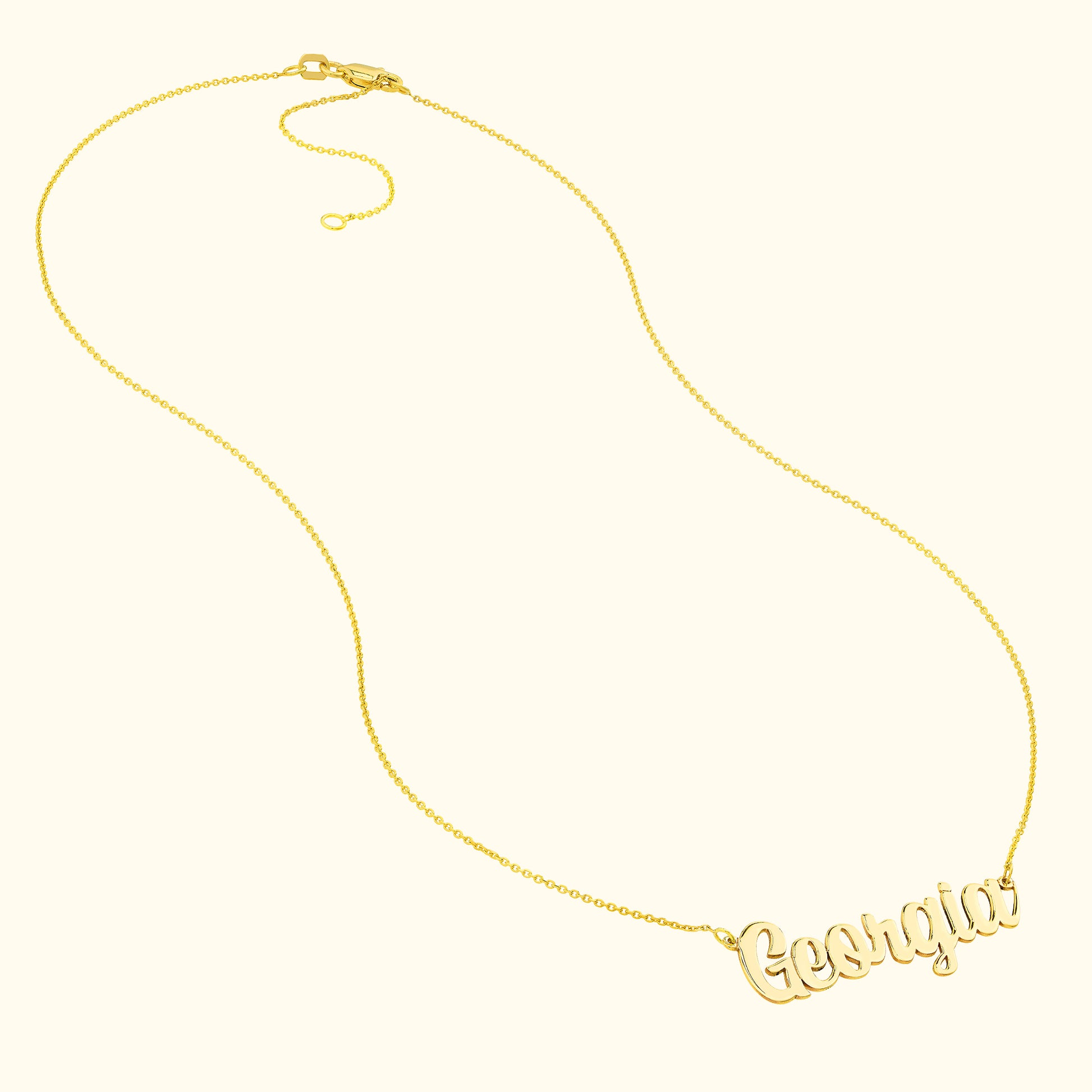 Gold necklace featuring the name "Georgia" in a cursive font.