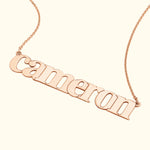 Rose gold necklace featuring the name "Cameron" in elegant, flowing letters.