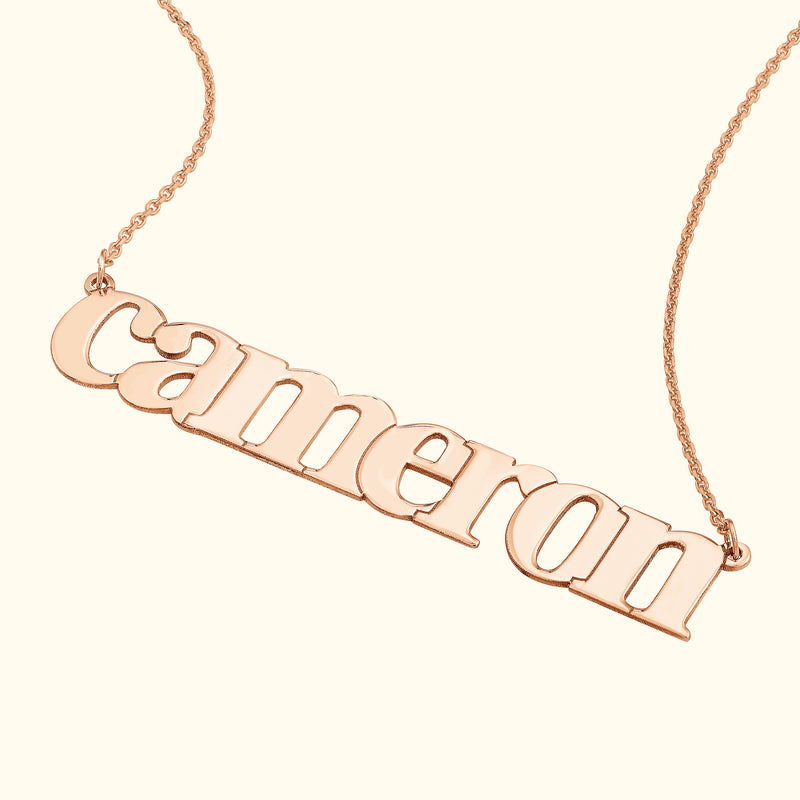 Rose gold necklace featuring the name "Cameron" in elegant, flowing letters.
