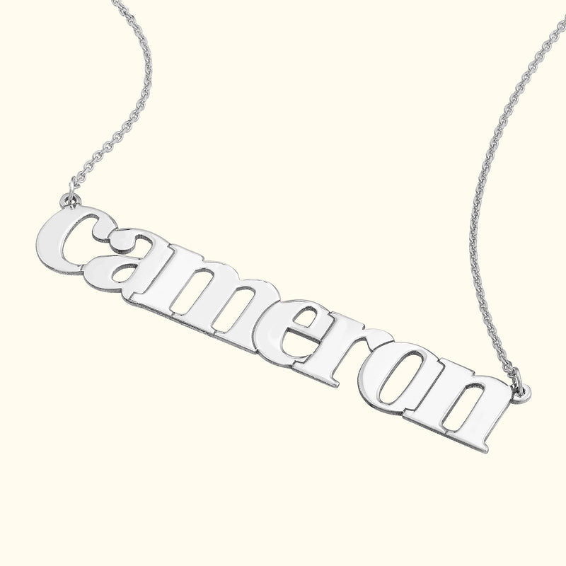 Silver name necklace with the word "cameron" in a stylish font.