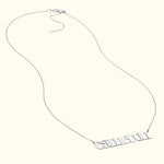 Silver necklace featuring a custom nameplate with the name "Cameron."
