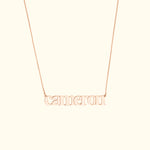 Rose gold necklace featuring the name "Cameron" in a stylish font.
