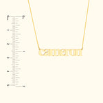 Gold name necklace featuring the name "Cameron" with a ruler for size reference.