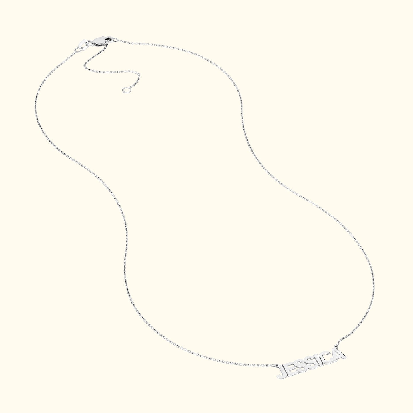 Silver necklace with a chain and personalized name "JESSICA" as the centerpiece.