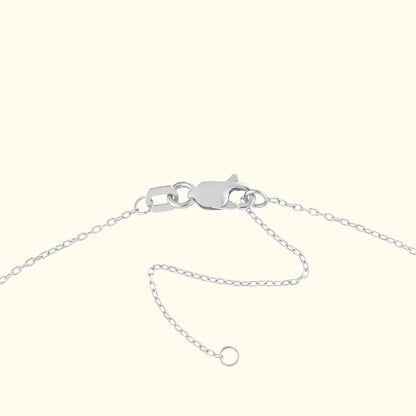 Silver chain necklace clasp with linked chain and adjustable extension.