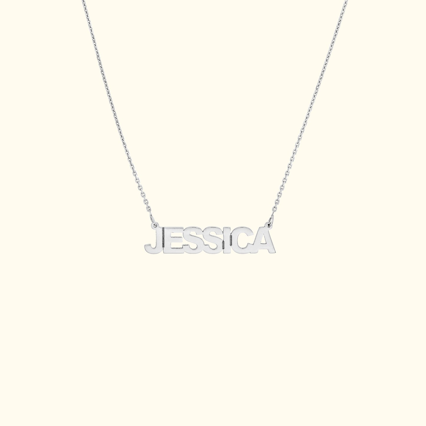 Silver necklace featuring the name "JESSICA" in bold, uppercase letters.