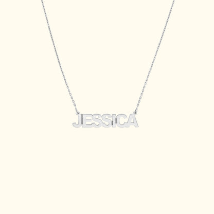 Silver necklace featuring the name "JESSICA" in bold, uppercase letters.