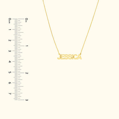 Yellow gold name necklace with the name "JESSICA" displayed prominently.