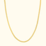 Elegant yellow gold chain necklace on a light background.