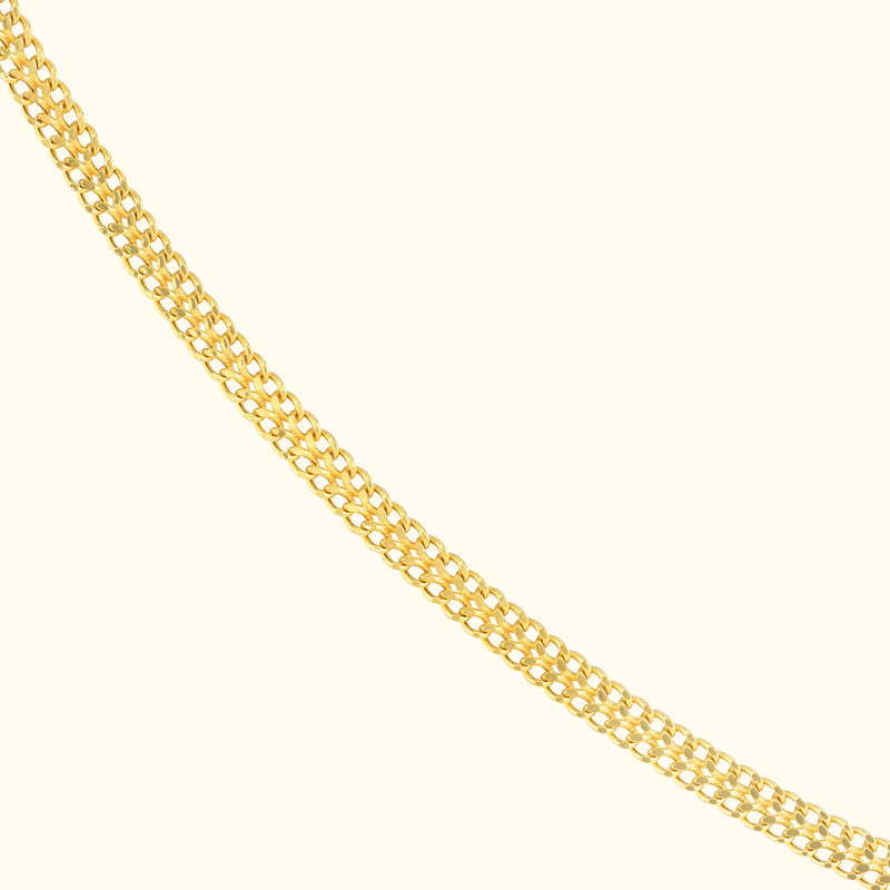 A delicate gold chain necklace with interlocking links, elegantly displayed.