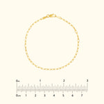 Delicate gold chain bracelet with a lobster clasp, displayed on a light background.