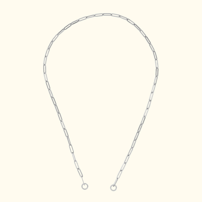 Silver chain necklace with elongated links, displayed against a light background.