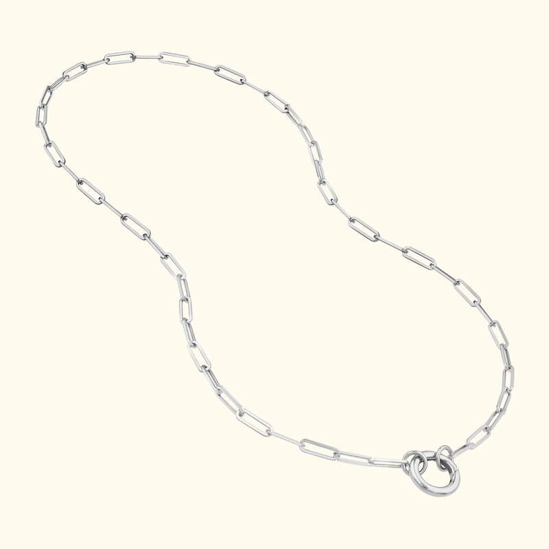 Silver chain necklace with elongated links and a circular clasp.